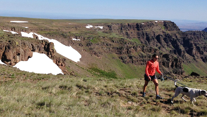 MAN HIKING WITH DOG